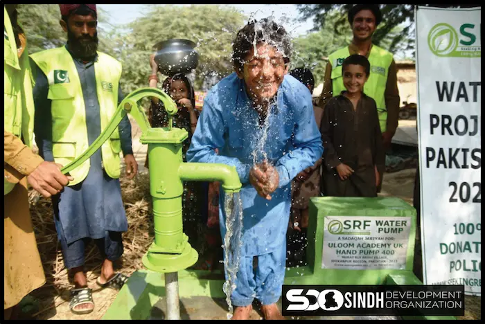Boy washing face from small handpumps from SDO in village